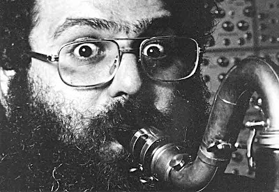 David Ocker, bearded and wild-eyed, playing bass clarinet at UMRK studio ca. 1982