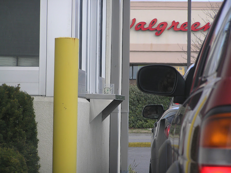 The car in the front is a sedan, the car behind it is an SUV. Notice the height of the ledge in relation to the car.