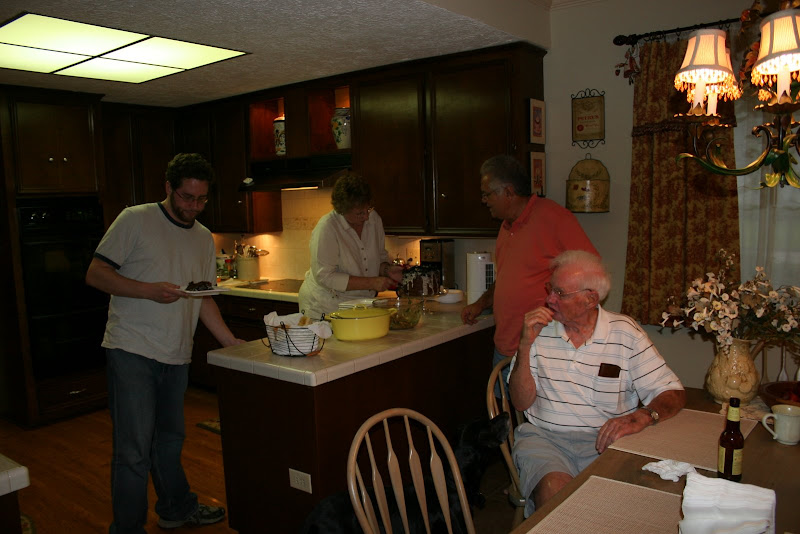 Jeff bringing cake to Warren