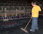 Jarod Cernousek (age 8) sweeping up before a show. Photo by Carter Leibbrandt.