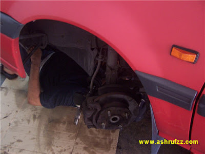 Ashrufzz Car being repaired by a mechanic