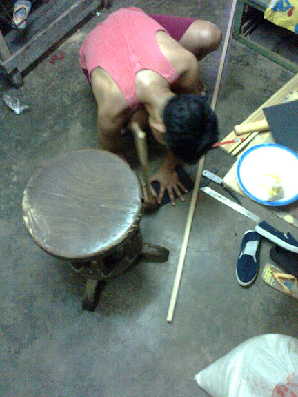 Wilson filing the ends of a frame part.