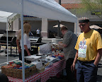 Thor Thorsen enjoys a hamburger and chips. Proceeds of the booth benefit the local Easter Seal Society.