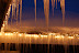 Glittering icicles light up a quiet snowy winter evening in  McCall, ID.