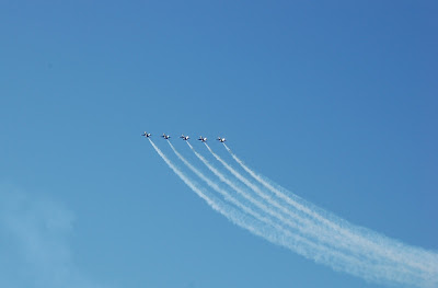 Blue Angels in formation, tails glinting in sun over San Francisco Bay. Photo by Lisa Callagher Onizuka