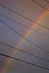Rainbow and power lines. 