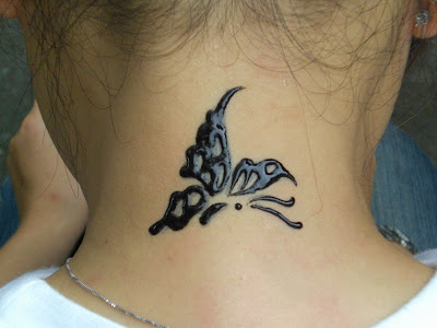 embossed butterfly tattoo on neck
