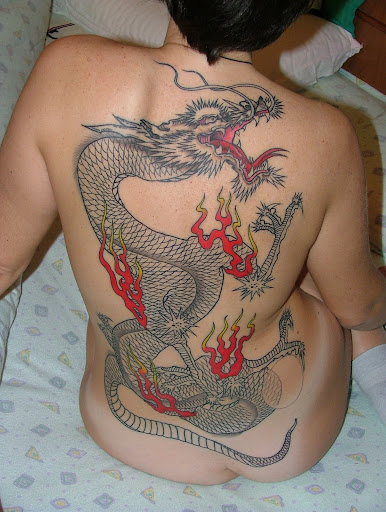 Sexy women with her temporary dragon tattoo in the body 7854236.jpg