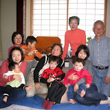 Starting in the back, going clockwise: Maria's aunt Hiroko, her husband Masuda-san, Hiroko's daughter Makiko holding Eidan, Maria holding Kai, Hiroko's daughter Akiko holding her daughter Karin, Maria's aunt-in-law Masako holding Makiko's son Tatsuki