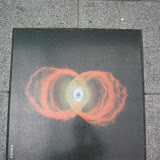 The road in Tenmonkan has a number of tiles depicting astronomical phenomena. This is a favorite of mine, the Hourglass Nebula