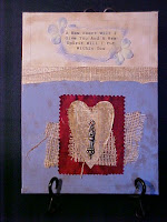 This is done on a 9x12 inch canvas board.  I used acrylics, old paper and fabrics with an old door knob on the heart.  I don't put hangers on my work, but you could easily attach a ribbon or twine if you should want to hang it.