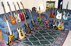 My Ibanez collection as of Nov 2001... L to R back: RG7620-GN, RG7CT-VV Prestige, RG2020x-BWS Prestige, RG3120-DR Prestige, RG3120-TW Prestige, Jem7-RB, Jem7-VWH, Jem90-HAM; L to R front: RG-ART J-Custom, MA1FM American Master, RG1880-BGS J-Custom, JPM90-HAM, JPM100-P1, JPM100-P2, UV777-BK Universe, UV77-MC Universe