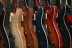 Up close & personal... L to R: PRS Singlecut, PRS McCarty Rosewood, 4 PRS Custom 24’s, Ibanez JPM100-P1