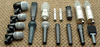 Most of the current mic collection (upgraded early 2006)... Left side: Shure PG52, (3) PG56’s; Front row: Audio Technica Midnight Blues, Shure SM58, (2) Shure SM57’s, Audix i5, Sennheiser e609; Back row: Sennheiser MD421-II, ShinyBox 46 ribbon, (2) Studio Projects C4’s, KEL Audio HM-1, Studio Projects C1, Studio Projects T3