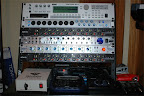 Former studio rack (late 2007)... Top to bottom: Korg Triton rackmount workstation/sampler, Presonus DigiMax FS preamp/ADA converter, ART MDM-8L compressor/limiter, Focusrite OctoPre LE preamp/ADA converter, Presonus DigiMax LT preamp/AD converter, ART MDM-8L compressor/limiter, Studio Projects T3 power supply, Frontier Design TranzPort, SM Pro Audio Nano Patch, Rolls HA43 headphone amp