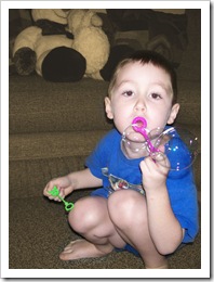 Nicholas blowing bubbles