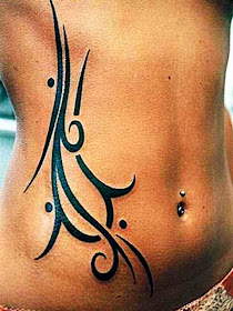 Extreme Man with Tribal Tattoo Design and Piercing